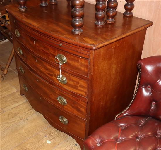 A George III mahogany bowfront chest with brushing slide, W.94cm D.58cm H.82cm
